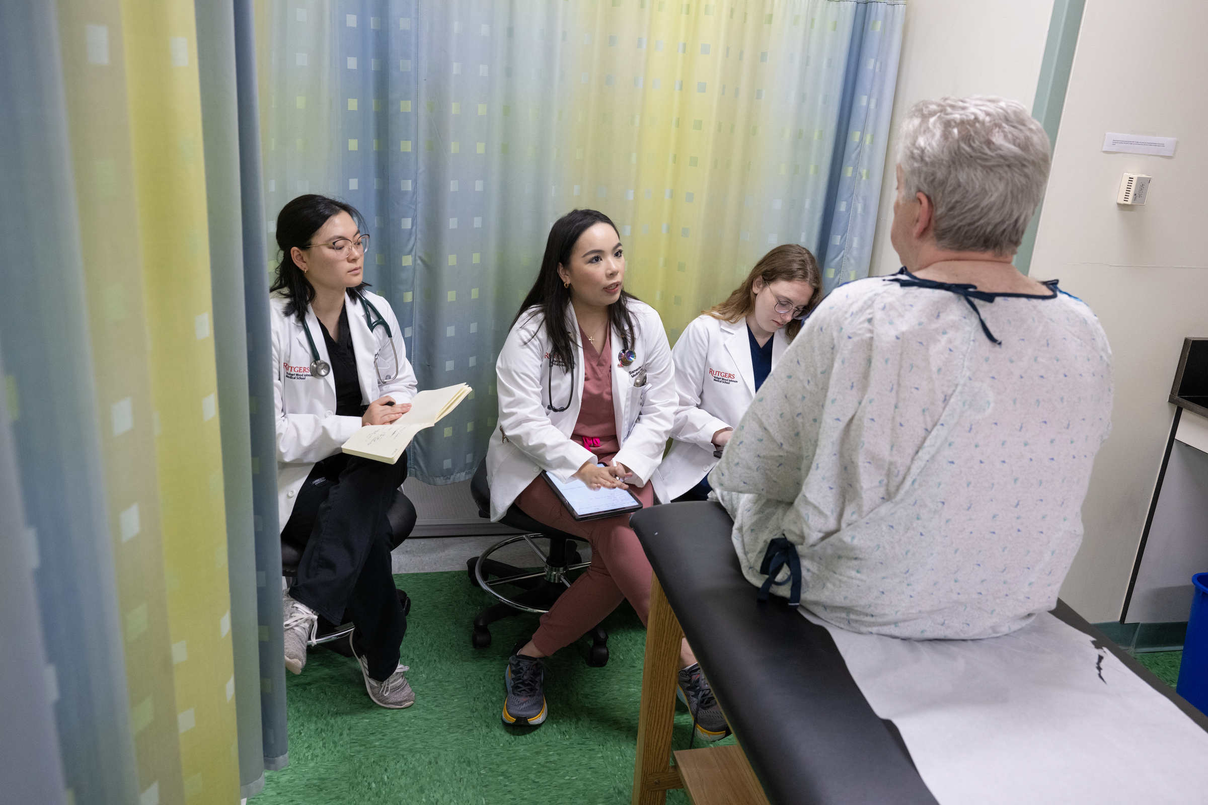 Medical Students working to intake a patient.